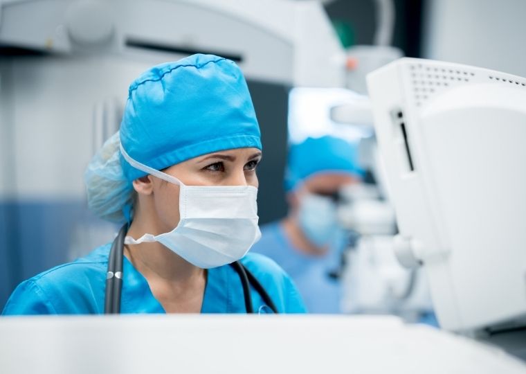 Medical worker looking at screen